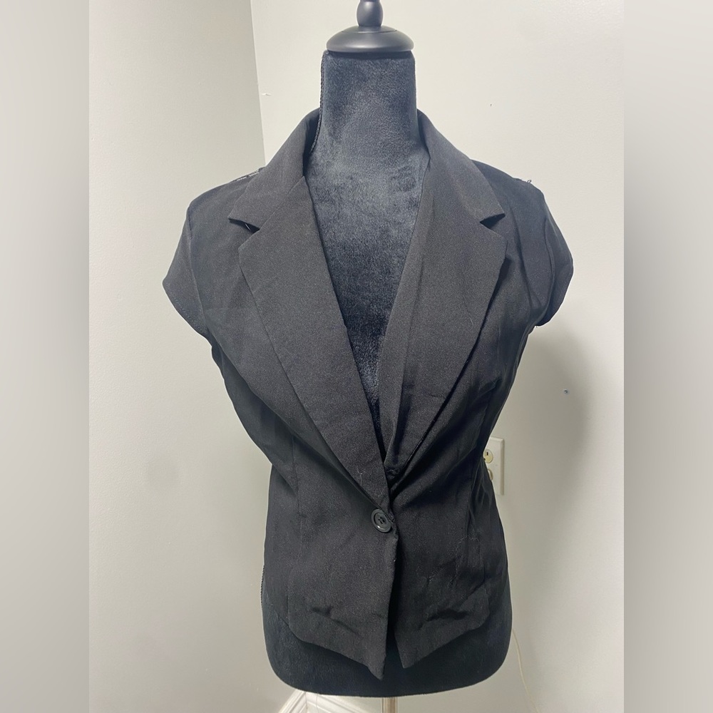 Large sleeveless blazer